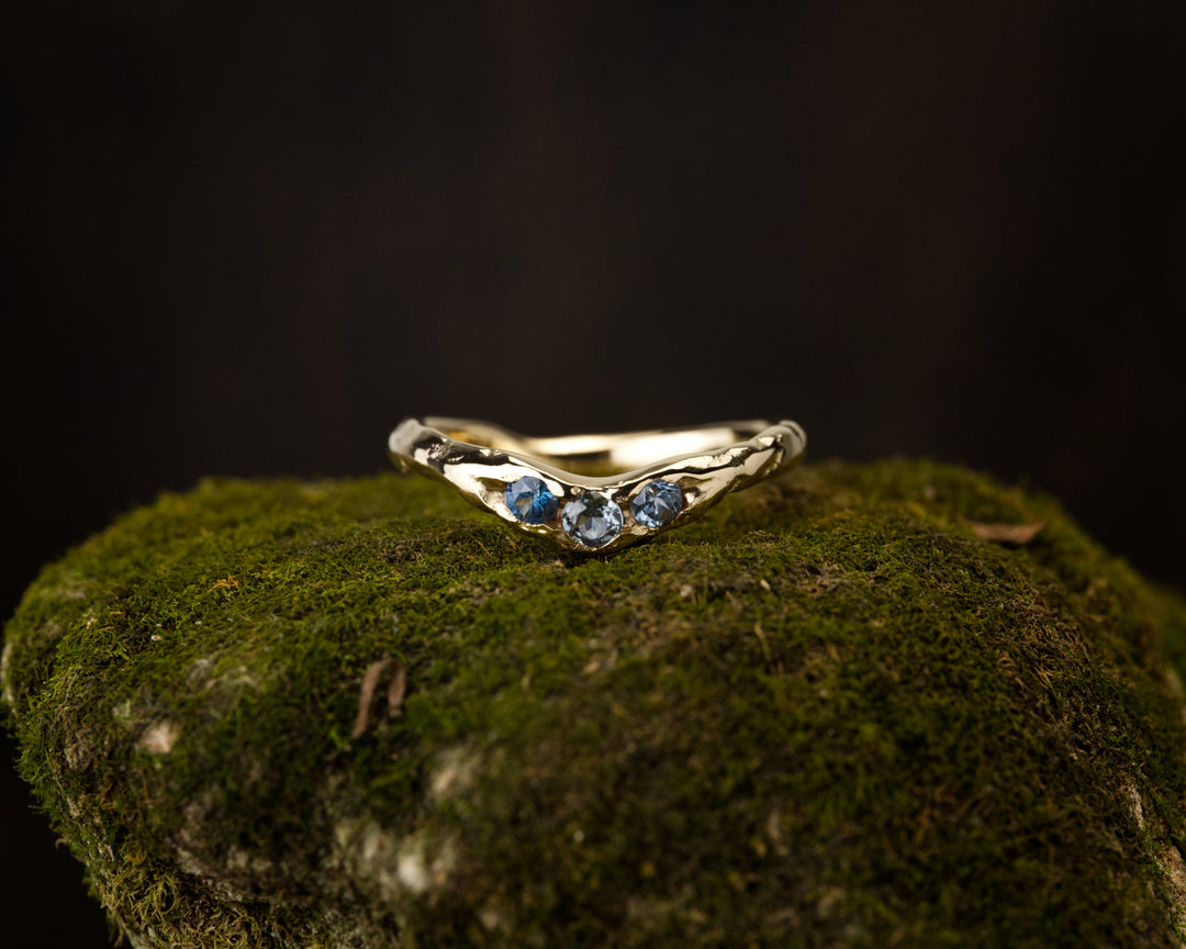 Curved Montana Sapphire Fit band Three Stone, handcrafted by Rigby Leigh