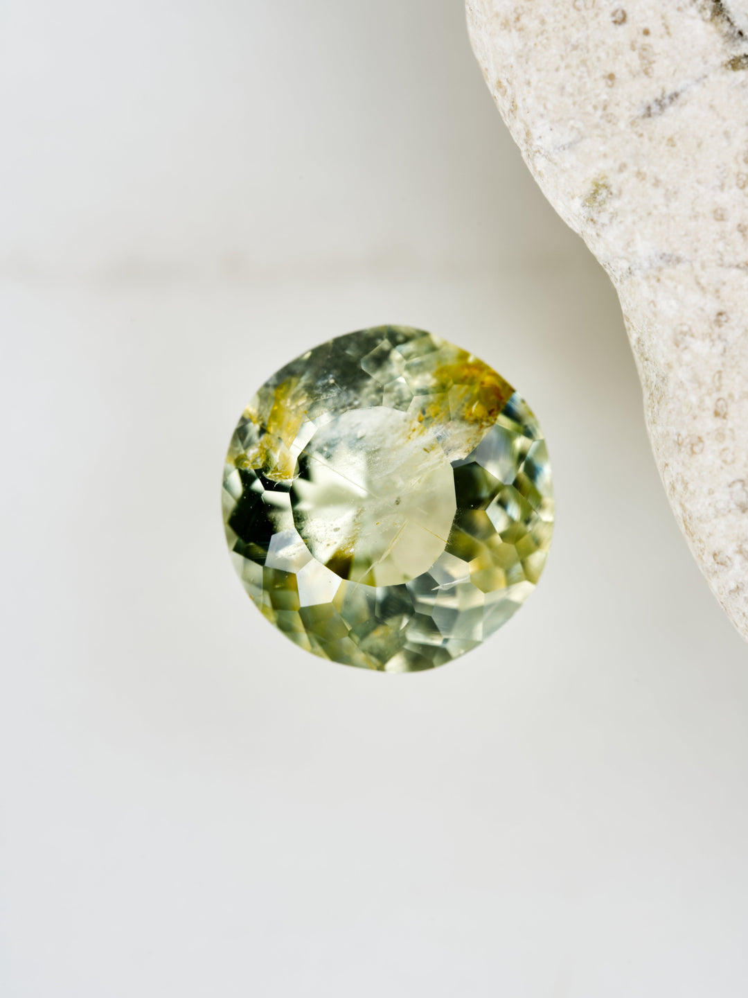 Lichen Glow — 1.550ct yellow round Montana sapphire, 7mm, unheated