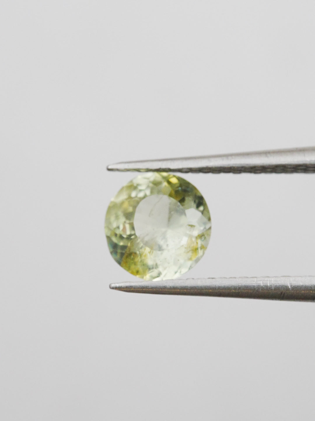Lichen Glow — 1.550ct yellow round Montana sapphire, 7mm, unheated